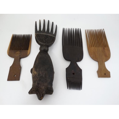 724 - Ethnographic Native Tribal : four assorted carved wooden African combs, the largest 11'' long