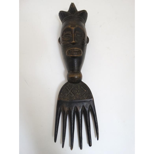 724 - Ethnographic Native Tribal : four assorted carved wooden African combs, the largest 11'' long