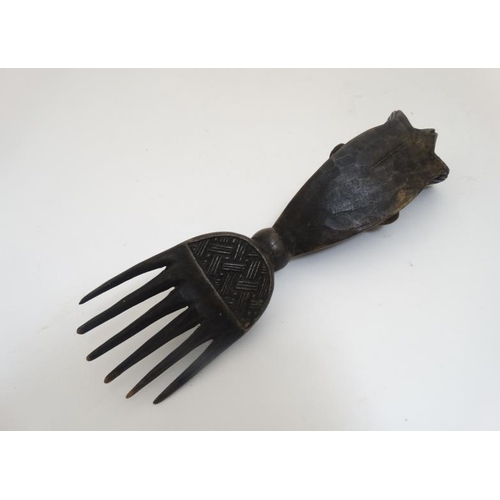 724 - Ethnographic Native Tribal : four assorted carved wooden African combs, the largest 11'' long