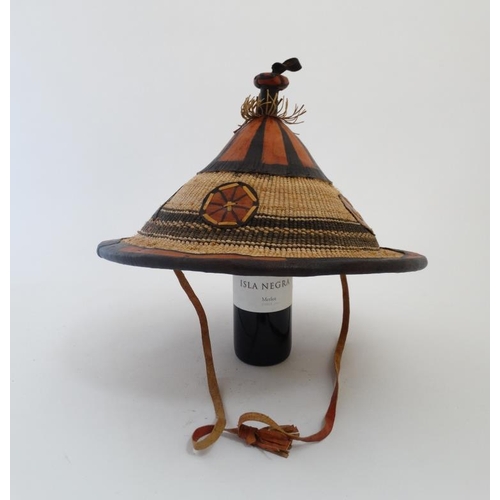 727 - Ethnographic Native Tribal :a South African hat from Lesotho , coloured with raffia like constructio... 