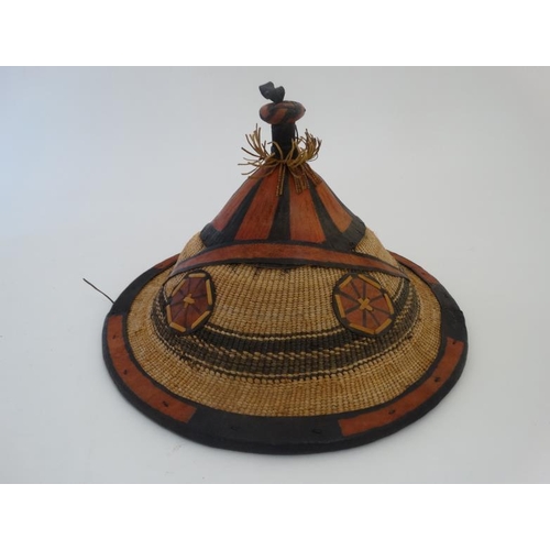 727 - Ethnographic Native Tribal :a South African hat from Lesotho , coloured with raffia like constructio... 