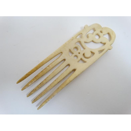 728 - Ethnographic native Tribal : a 19th / early 20th century fully worked carved ivory five tooth comb /... 