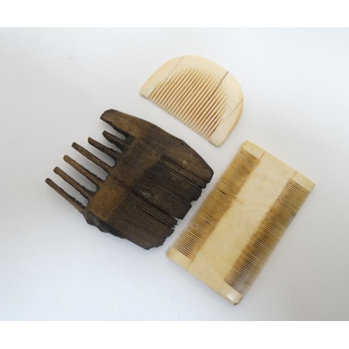 729 - Ethnographic Native Tribal : Two African caved ivory combs and a carved wooden comb, the largest 23 ... 