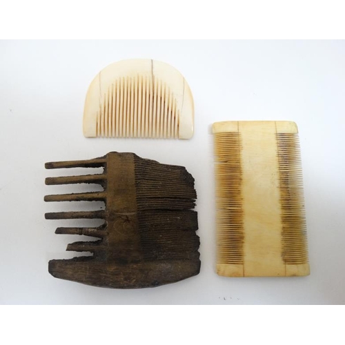 729 - Ethnographic Native Tribal : Two African caved ivory combs and a carved wooden comb, the largest 23 ... 