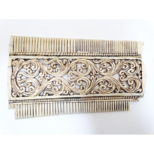 733 - Ethnographic Native Tribal : a circa 1900 ornate carved ( double sided ) ivory comb with carved teet... 