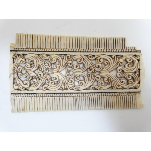 733 - Ethnographic Native Tribal : a circa 1900 ornate carved ( double sided ) ivory comb with carved teet... 