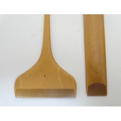 735 - Oriental Japanese Tribal : two carved boxwood signed hair piece combs , the largest 8 1/2'' long. (2... 