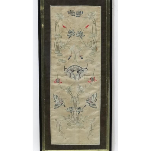 74 - Oriental kimono sleeve, Silk framed, Butterflies ,lillies and other foliage, 20 1/2 x 7 1/4''.