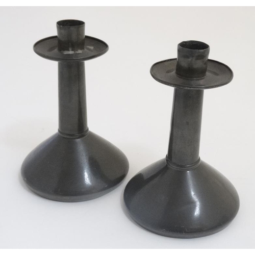 753 - Arts and Crafts : A pair of pewter Dresseresque candlesticks 6 1/4'' high