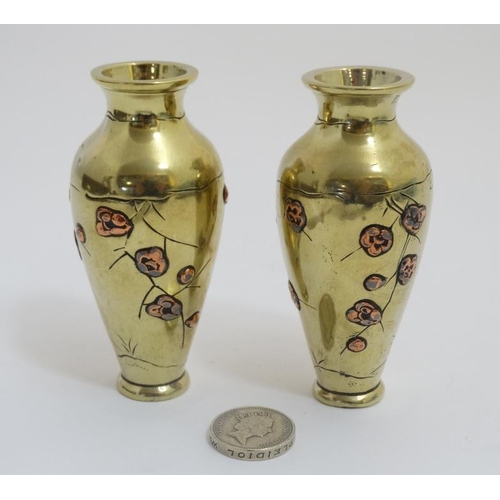 757 - A pair of Japanese brass and copper small baluster shaped vases. 3 1/2'' high . (2)