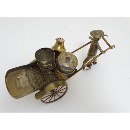 760 - A 19thC silver plated brass oriental rickshaw formed novelty cruet stand containing lidded basket, b... 