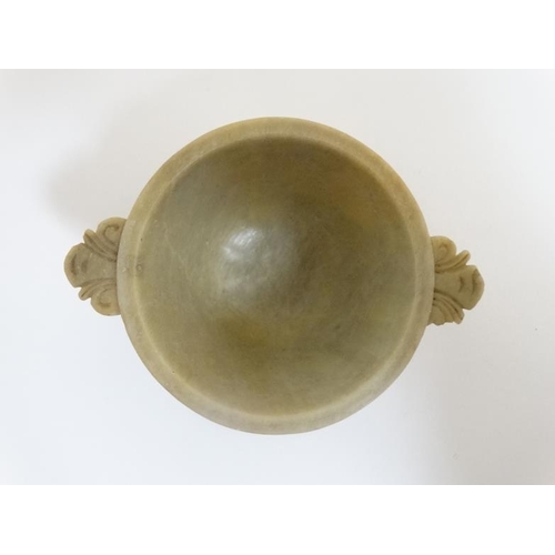 761 - A Chinese carved jade two handled libation cup 3 1/2'' wide x 2'' high