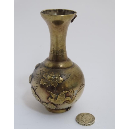 764 - A 19thC Japanese small vase with relief decoration standing 4 3/4'' high