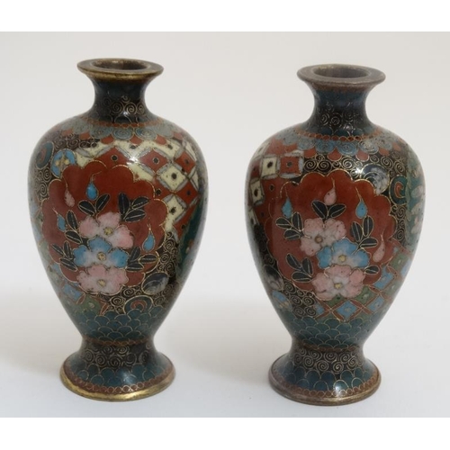 765 - A pair of Oriental cloisonne and gilt metal small baluster shaped vases 3 1/4'' high . (2)