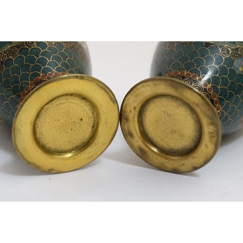 765 - A pair of Oriental cloisonne and gilt metal small baluster shaped vases 3 1/4'' high . (2)