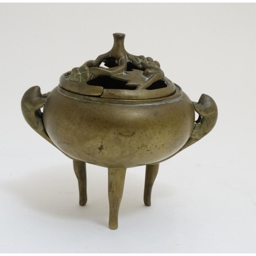 772 - Ming Dynasty : a Xuande ( 1426-1435 ) signed three footed brass lidded censer with tailed animal sid... 