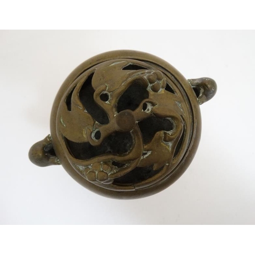 772 - Ming Dynasty : a Xuande ( 1426-1435 ) signed three footed brass lidded censer with tailed animal sid... 