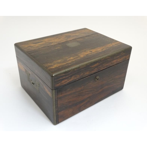 779 - A 19thC ladies Coromandel vanity box opening to reveal a fold down front with satinwood drawers and ... 