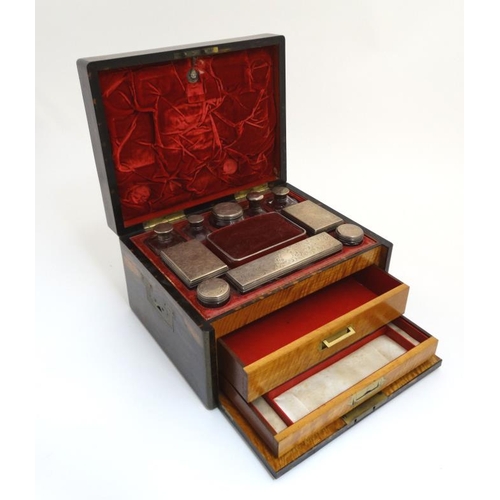 779 - A 19thC ladies Coromandel vanity box opening to reveal a fold down front with satinwood drawers and ... 