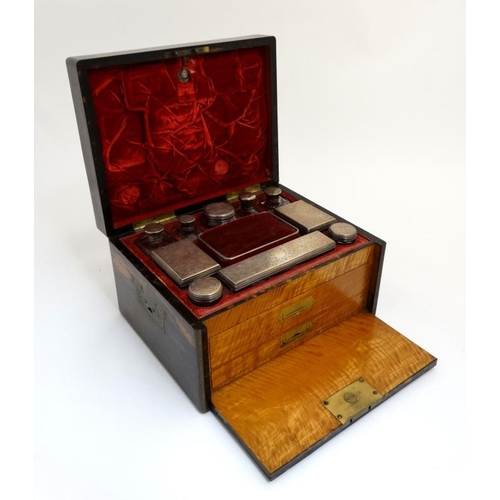 779 - A 19thC ladies Coromandel vanity box opening to reveal a fold down front with satinwood drawers and ... 