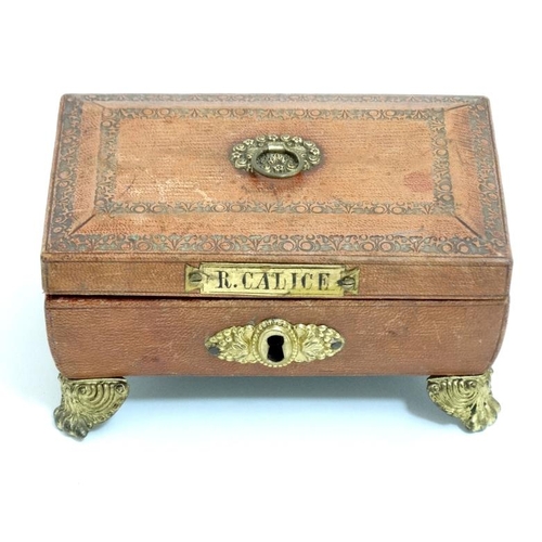 784 - A Regency gold tooled leather covered small sewing box with gilded legs, handle escutcheon etc pale ... 