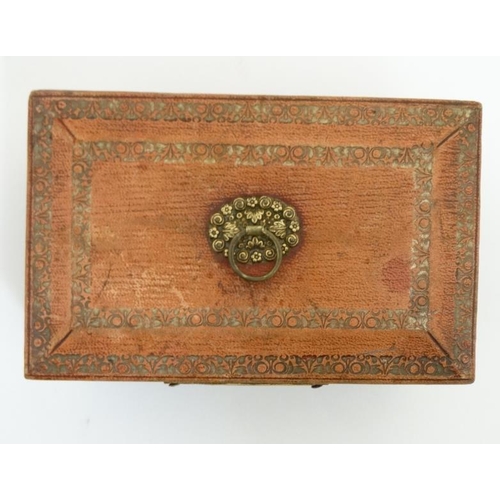 784 - A Regency gold tooled leather covered small sewing box with gilded legs, handle escutcheon etc pale ... 