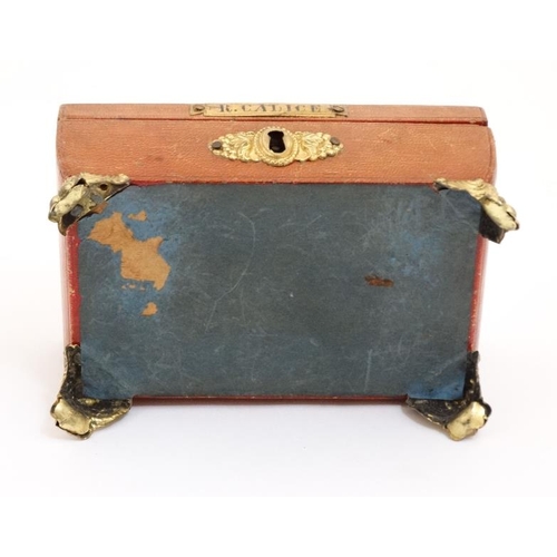 784 - A Regency gold tooled leather covered small sewing box with gilded legs, handle escutcheon etc pale ... 