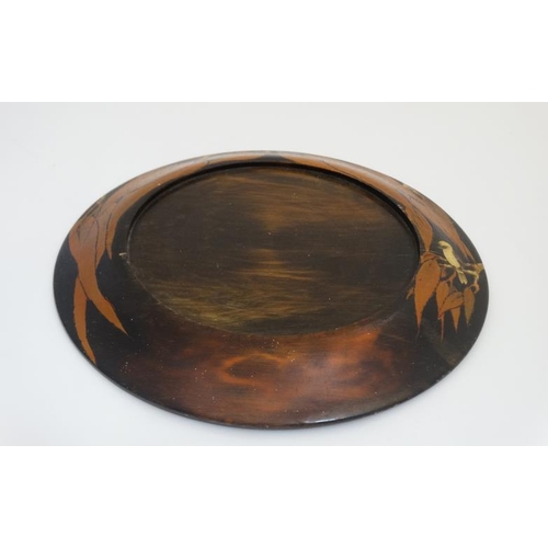 786 - An Australian circular painted stand depicting a Koukaborrough amongst Eucalyptus 11 3/8'' diameter