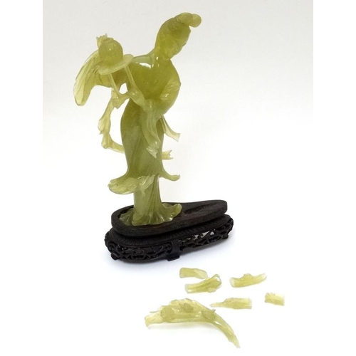 787 - A Chinese jade / jadeite figure and stand, 9 3/4'' high