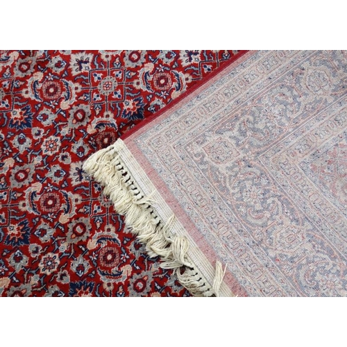 79 - Rug / Carpet :  a 20 thC Belgian Wilton rug with wine ground and 3 band borders,  100 x 65 1/2''