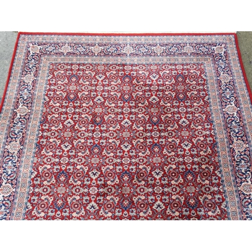 79 - Rug / Carpet :  a 20 thC Belgian Wilton rug with wine ground and 3 band borders,  100 x 65 1/2''