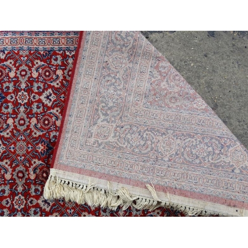 79 - Rug / Carpet :  a 20 thC Belgian Wilton rug with wine ground and 3 band borders,  100 x 65 1/2''