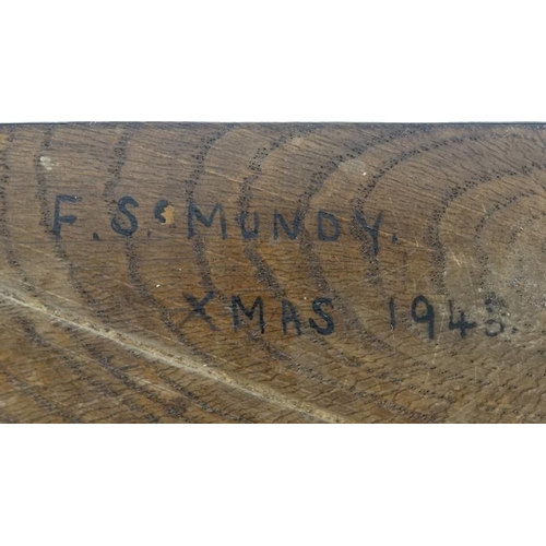 791 - A 1920's oak desk calendar having day date and month apertures 6 1/2'' high x 4 7/8'' wide