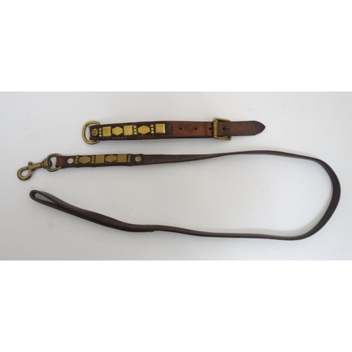 795 - A matching leather dog collar and lead with brass decoration. The lead 44'' long , the collar 21 1/2... 