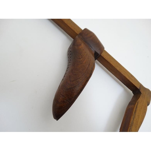 797 - Folk Art : A carved mahogany foot measure with two carved shoes, turned finial etc. The whole approx... 