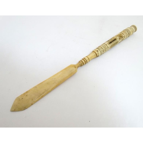 810 - A 19thC carved bone Stanhope paperknife, the Stanhope section unscrewing  to reveal section within w... 