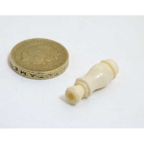 815 - Stanhope: A turned ivory monocular depicting a Victorian sepia risque image within. Approx 1'' long