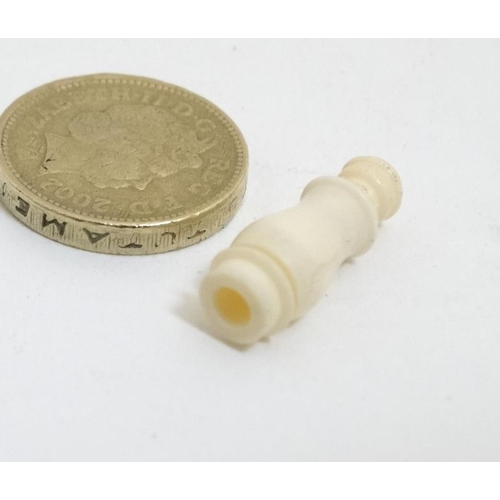 815 - Stanhope: A turned ivory monocular depicting a Victorian sepia risque image within. Approx 1'' long