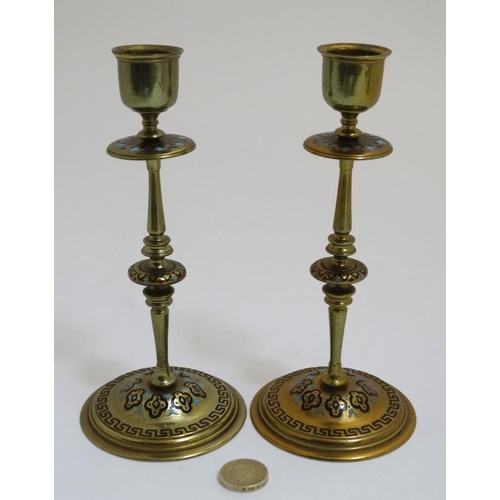 816 - A pair of 19thC Arts and Crafts brass and enamel turned candlesticks. 7 1/2'' high