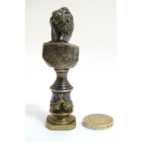 818 - A 19thC silvered brass ornate desk / hand seal in the form of an 18thC female bust on ornate fluted ... 