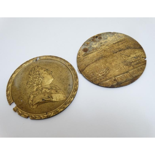 819 - A pair of 19thC gilded medallions mounted on tortoiseshell, one depicting the Palace of Versaillles,... 