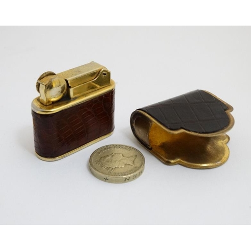 820 - A vintage cigarette lighter by Bric Lux of Paris with gilded and crock skin envelope like covering 1... 