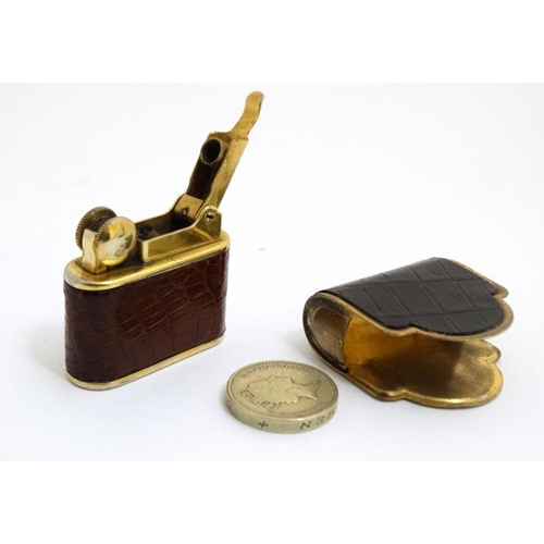 820 - A vintage cigarette lighter by Bric Lux of Paris with gilded and crock skin envelope like covering 1... 