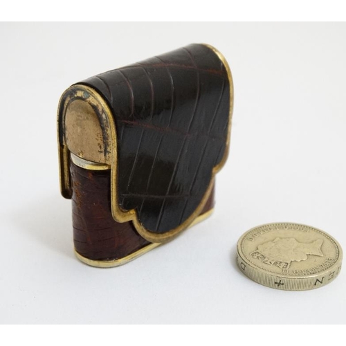 820 - A vintage cigarette lighter by Bric Lux of Paris with gilded and crock skin envelope like covering 1... 