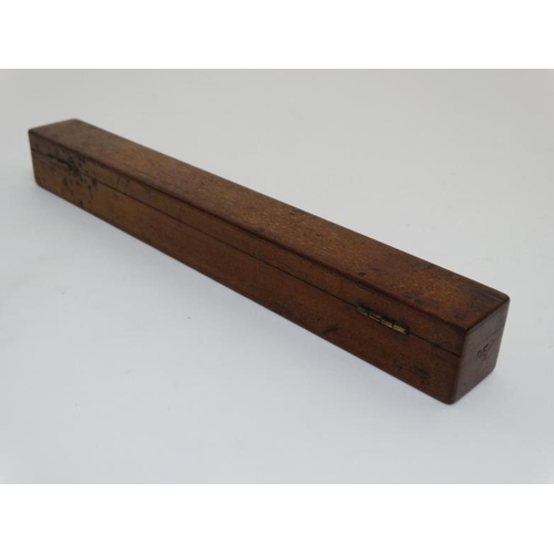 828 - A mahogany box opening to reveal 6 boxwood rulers by ' Davis & Son Derby ' , ' Bemrose & Sons Derby ... 