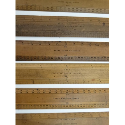 828 - A mahogany box opening to reveal 6 boxwood rulers by ' Davis & Son Derby ' , ' Bemrose & Sons Derby ... 