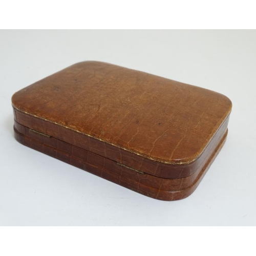 832 - An early 20thC crocodile skin hinged lidded box together with a leather purse the largest 8'' wide  ... 