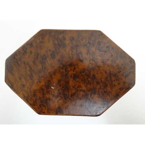 836 - A Georgian burr yew neoclassical tea caddy of lozenge shape. 4 3/4'' high x 5 1/2'' wide