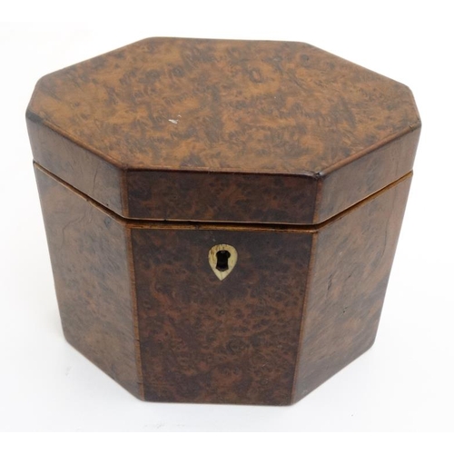 836 - A Georgian burr yew neoclassical tea caddy of lozenge shape. 4 3/4'' high x 5 1/2'' wide