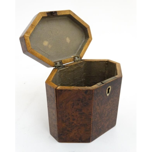 836 - A Georgian burr yew neoclassical tea caddy of lozenge shape. 4 3/4'' high x 5 1/2'' wide